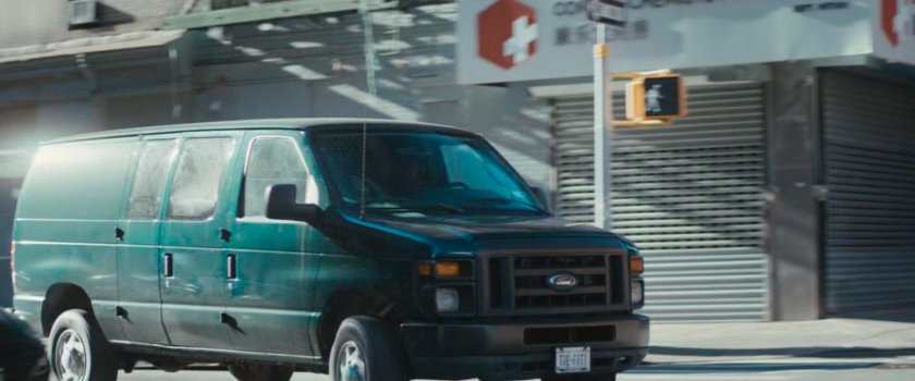 Van makes a right turn at corner.