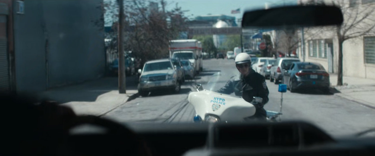 POV of motorcycle officer in front of van.