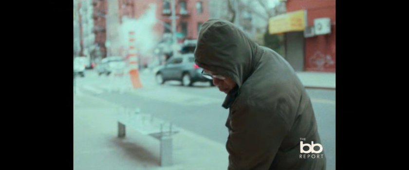 BB Report: man sweeping sidewalk.