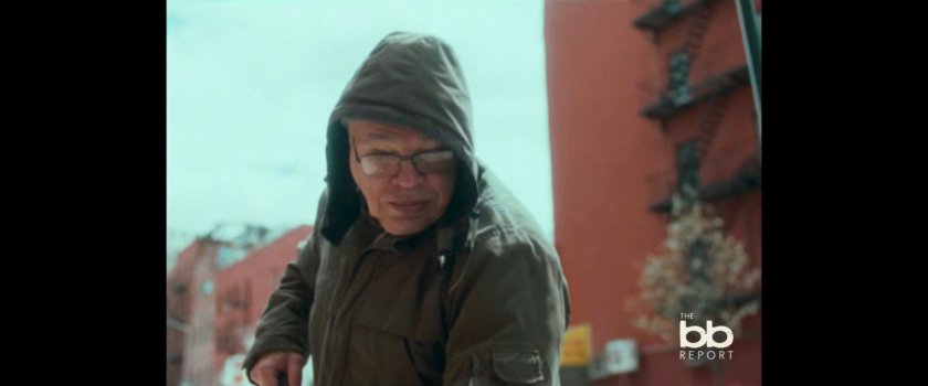 BB Report: man sweeping sidewalk.