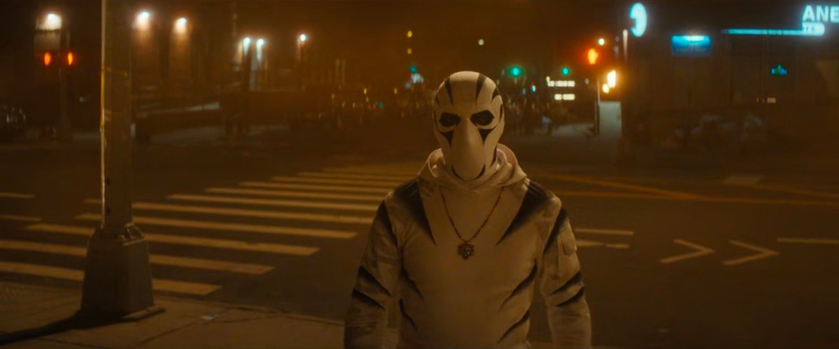White Tiger on the sidewalk at night.
