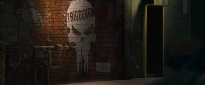 Interstitial: Punisher logo 'triggered' graffiti.