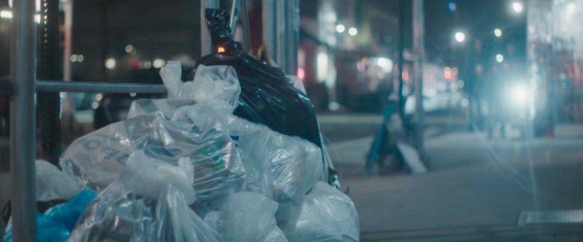 Interstitial: bags of trash on sidewalk.
