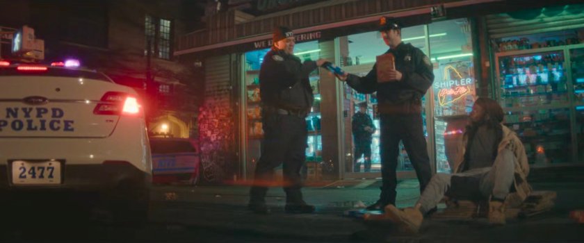 Leroy Mancini being detained by police outside bodega.