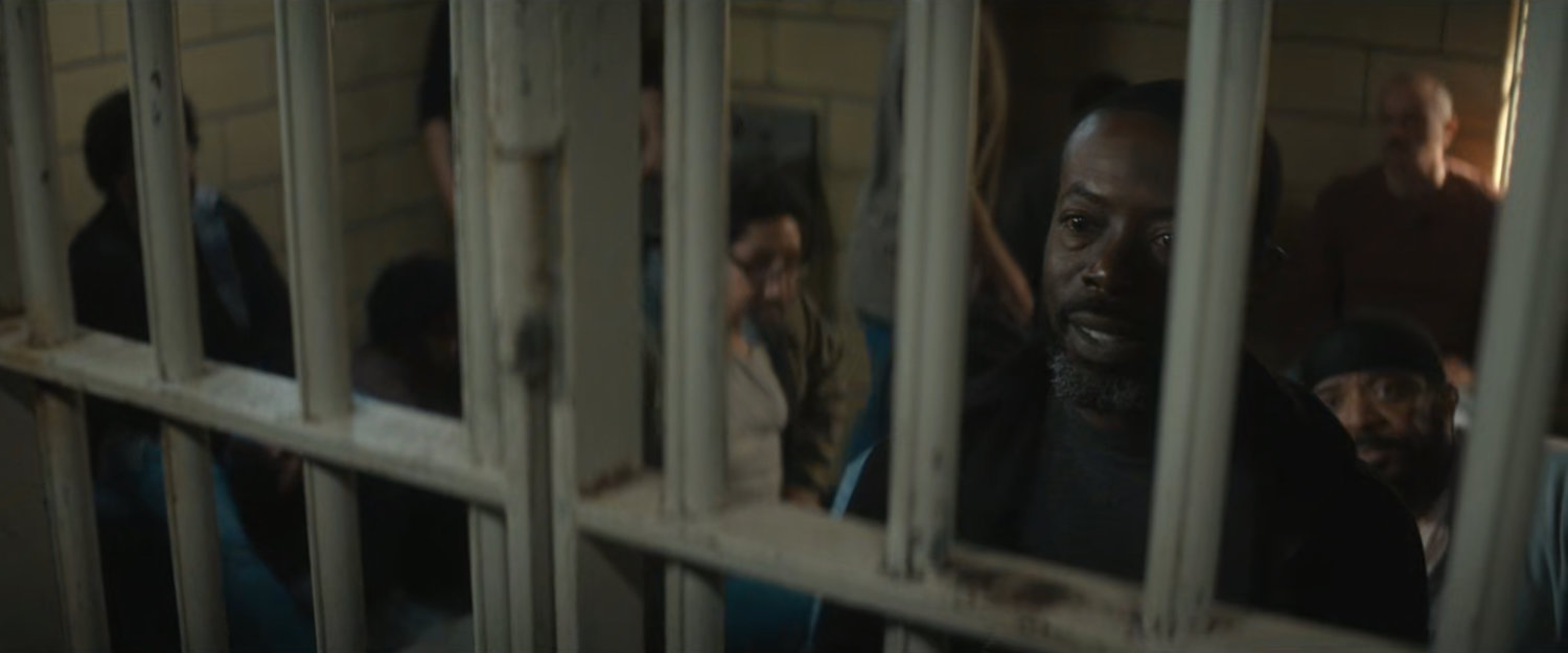 Leroy in the holding cell at the 15th Precinct.