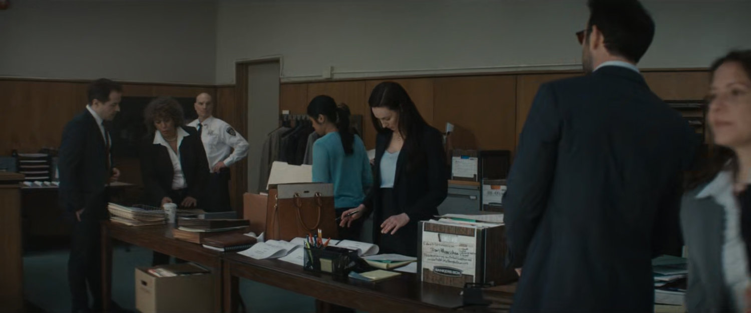 Matt speaking with Sofija in the city courtroom.