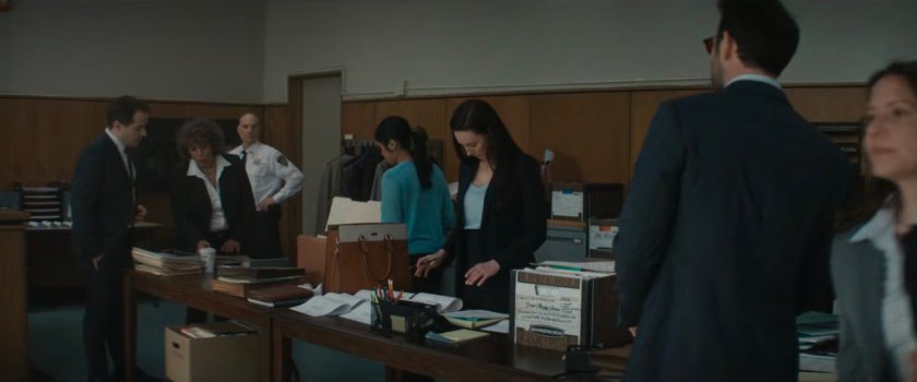 Matt speaking with Sofija in the city courtroom.