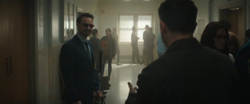 Matt and Officer Powell in the hallway of the city court.