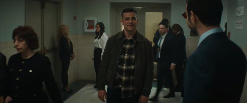 Matt and Officer Powell in the hallway of the city court.