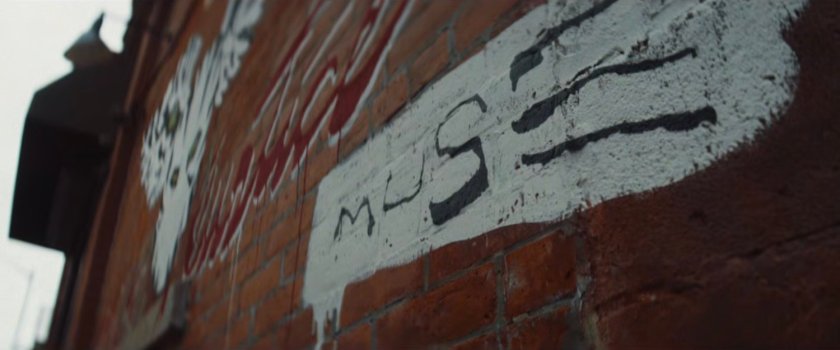 Interstitial: Muse signature on graffiti.