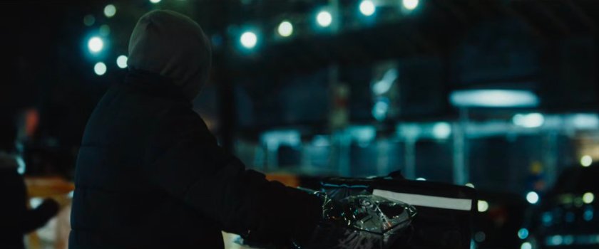 Interstitial: delivery driver on moped at night.