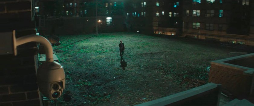 Matt crosses a courtyard.