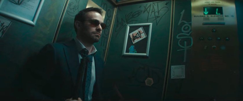 Matt in a graffiti'd elevator.