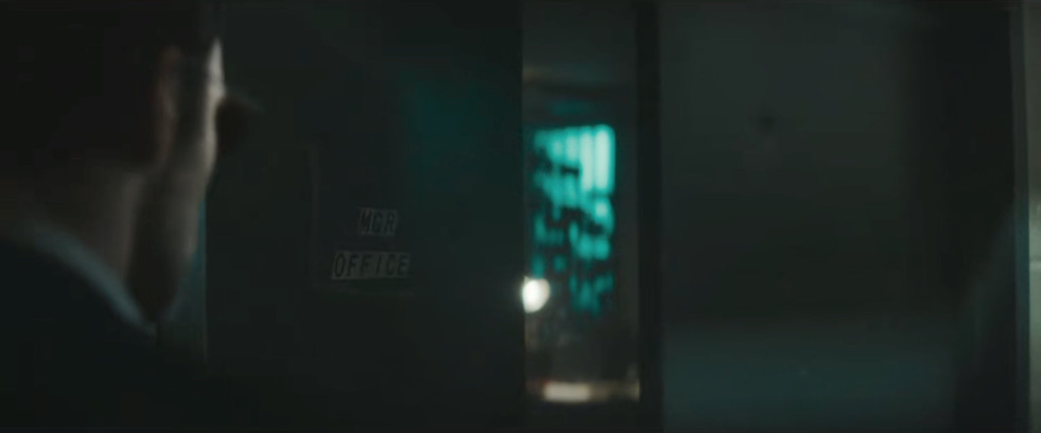 Matt in basement of Punisher's hideout, entering manager's office.