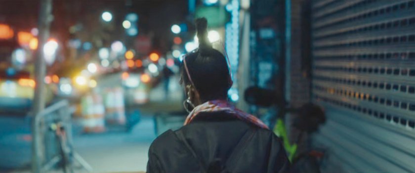 Interstitial: woman on sidewalk.