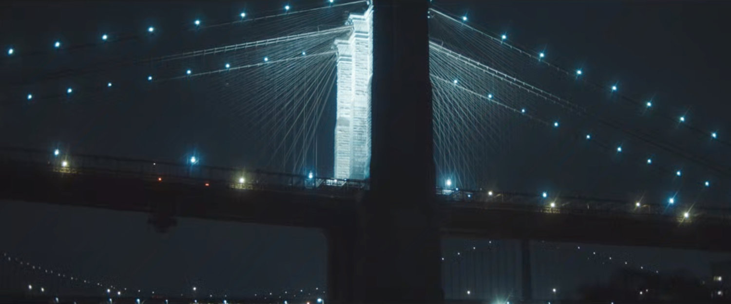 Interstitial: Brooklyn Bridge at night.