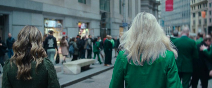 Interstitial: people walking along street.