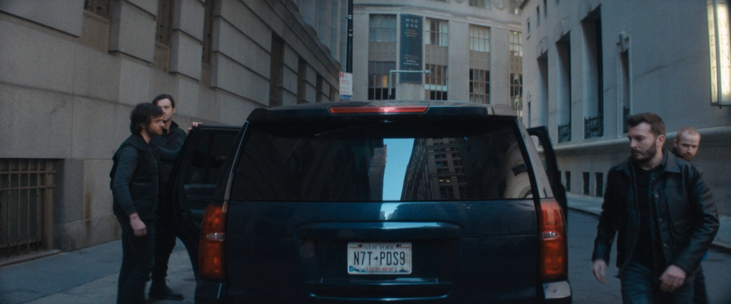 Robbers outside New York Mutual Bank.