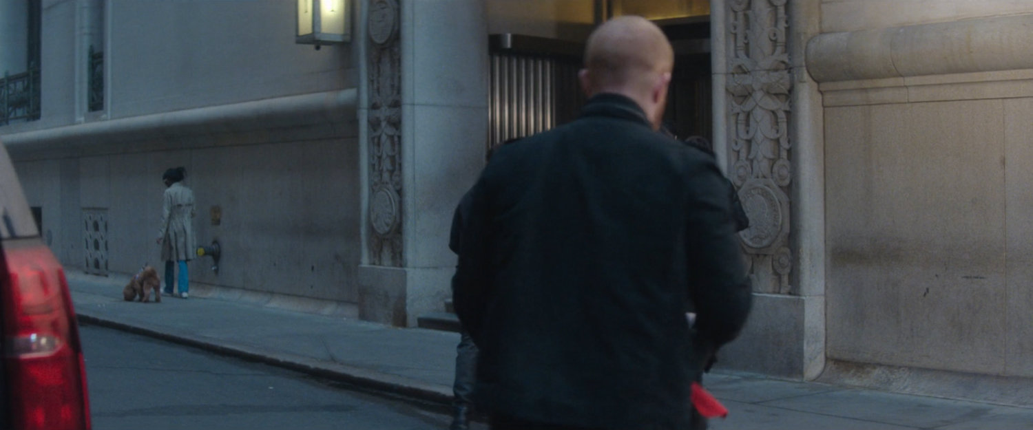 Robbers entering side entrance of New York Mutual Bank.