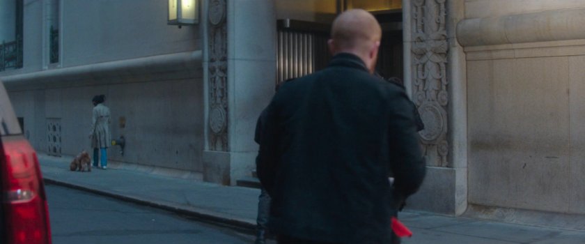Robbers entering side entrance of New York Mutual Bank.