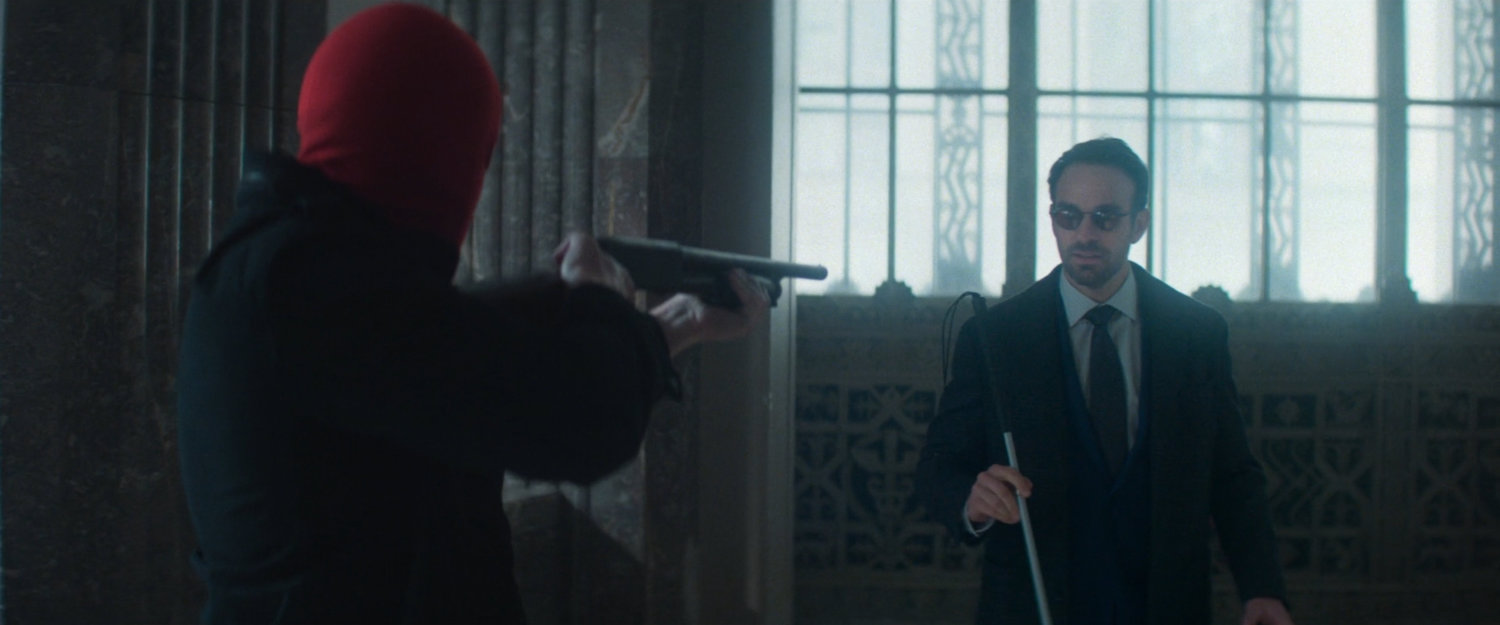 Robber holds shotgun on Matt inside New York Mutual Bank.