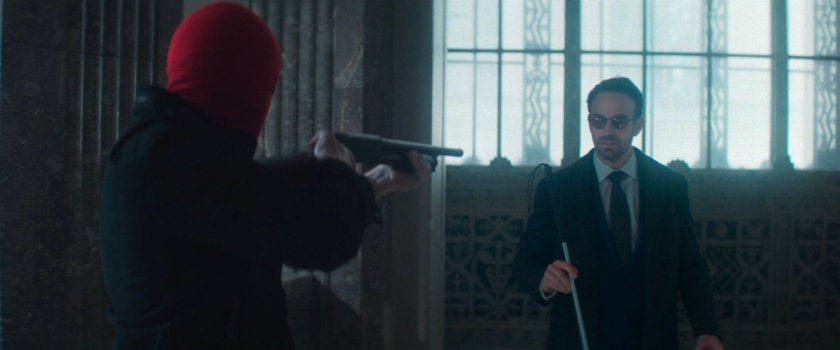 Robber holds shotgun on Matt inside New York Mutual Bank.