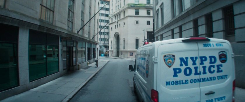 NYPD van pulling up outside New York Mutual Bank.