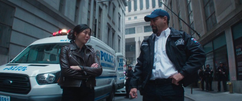 Detective Kim and Captain Rodriguez outside New York Mutual Bank.