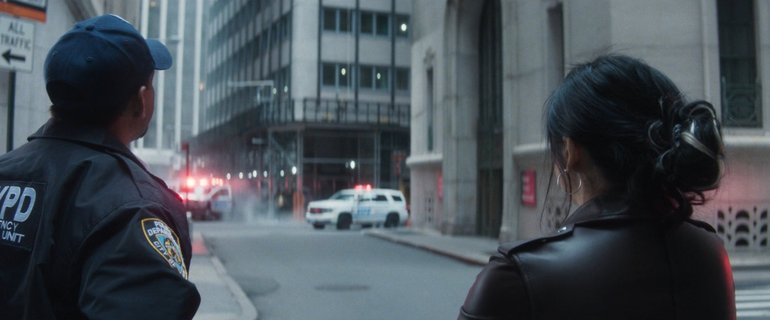 Detective Kim and Captain Rodriguez outside New York Mutual Bank.