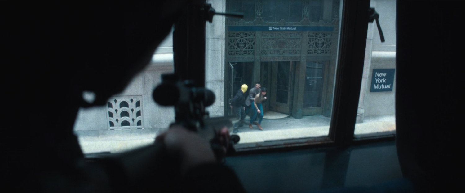 Two hostages being released from the entrance of New York Mutual Bank.