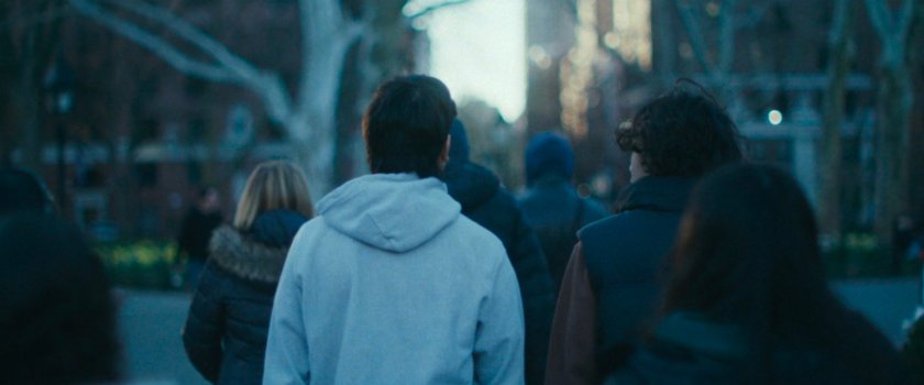 Interstitial: people walking through park.