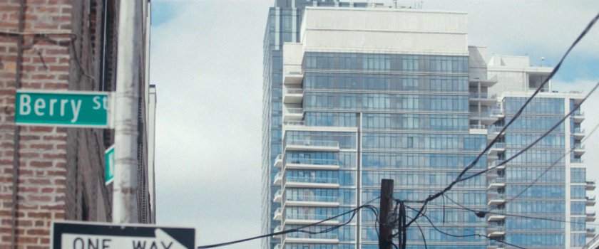 Interstitial: Berry Street sign and large apartment complex.