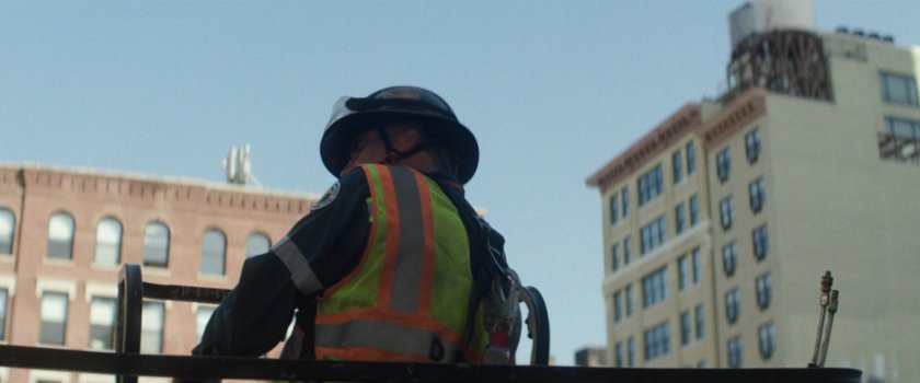 Sanitation worked on lift near buildings.