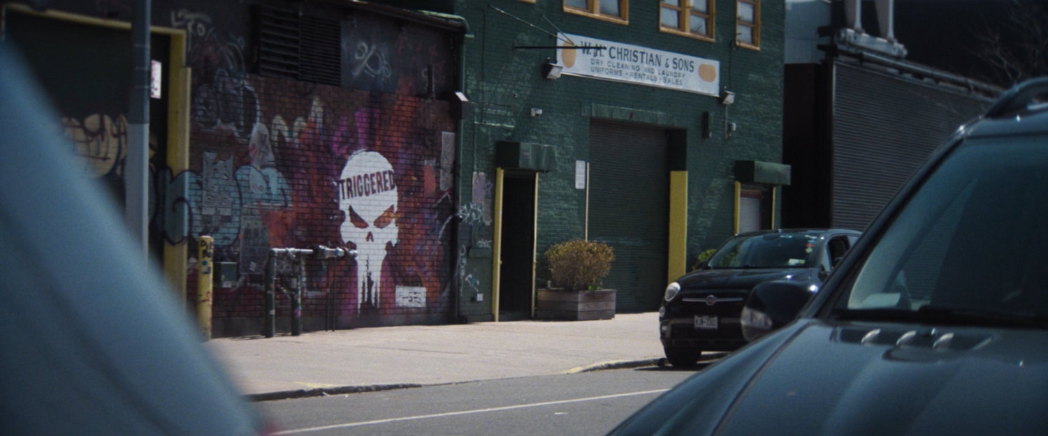 Interstitial: Punisher logo 'triggered' graffiti.
