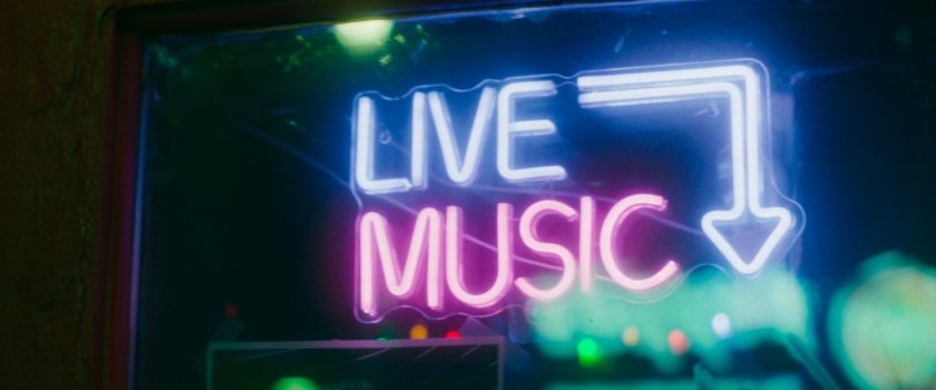 Interstitial: close-up of 'Live Music' neon sign.