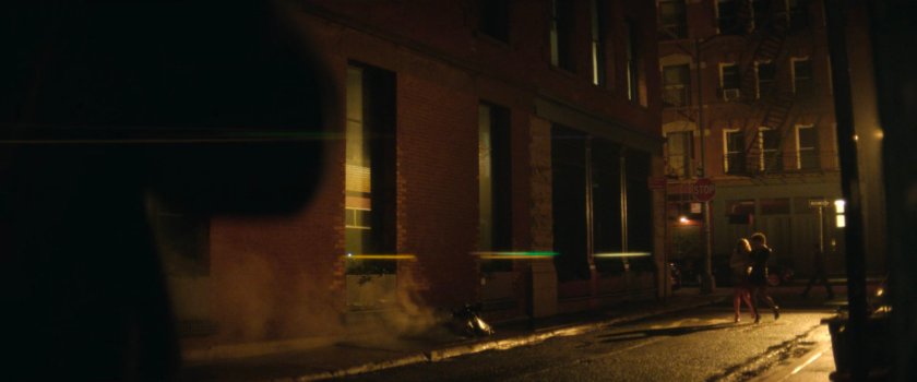 Two ladies enter a dark alley.