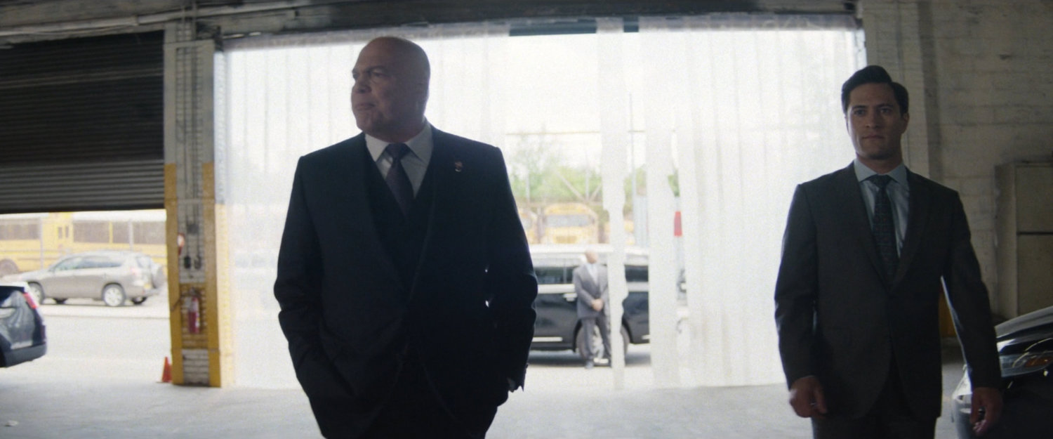 Fisk and Buck enter police garage.
