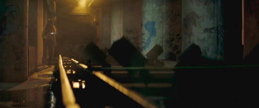 Angela walks towards Muse's lair.