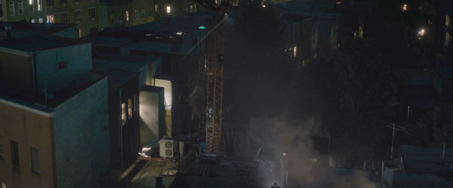 Daredevil running across rooftops.
