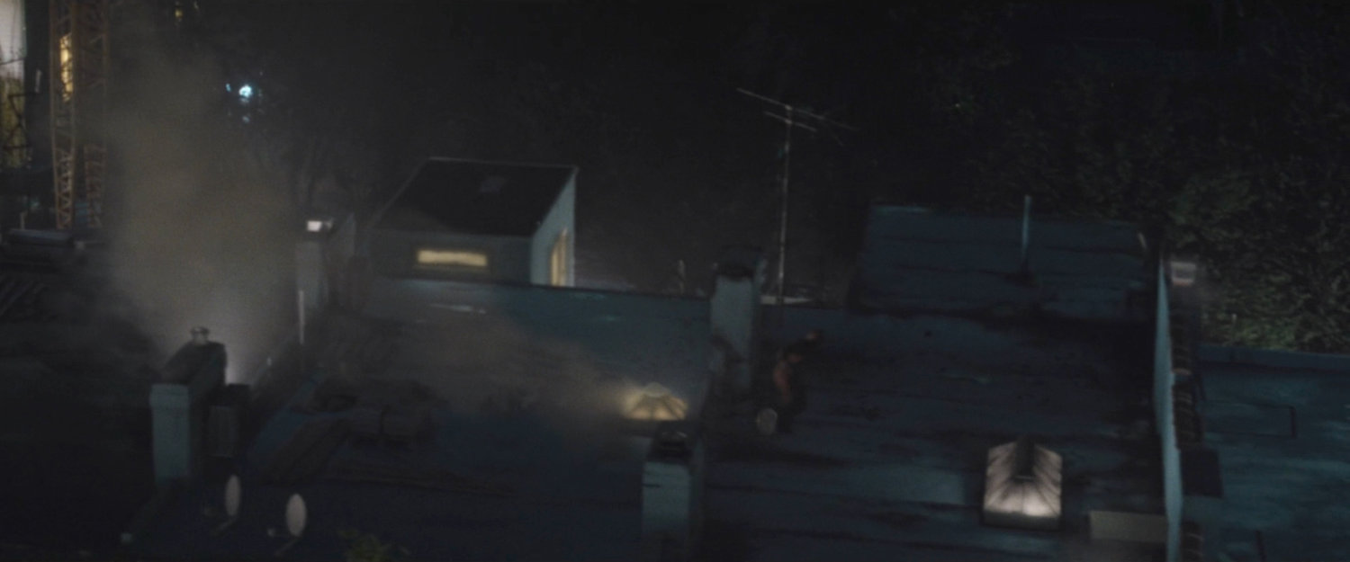 Daredevil running across rooftops.