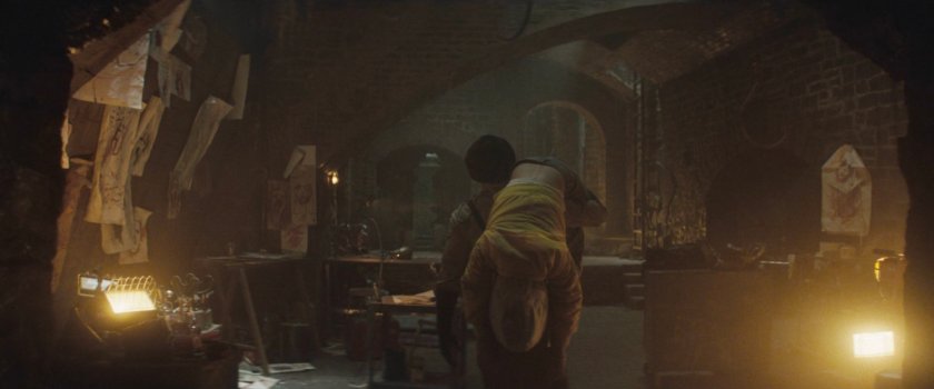 Muse carrying unconscious Angela into his lair.