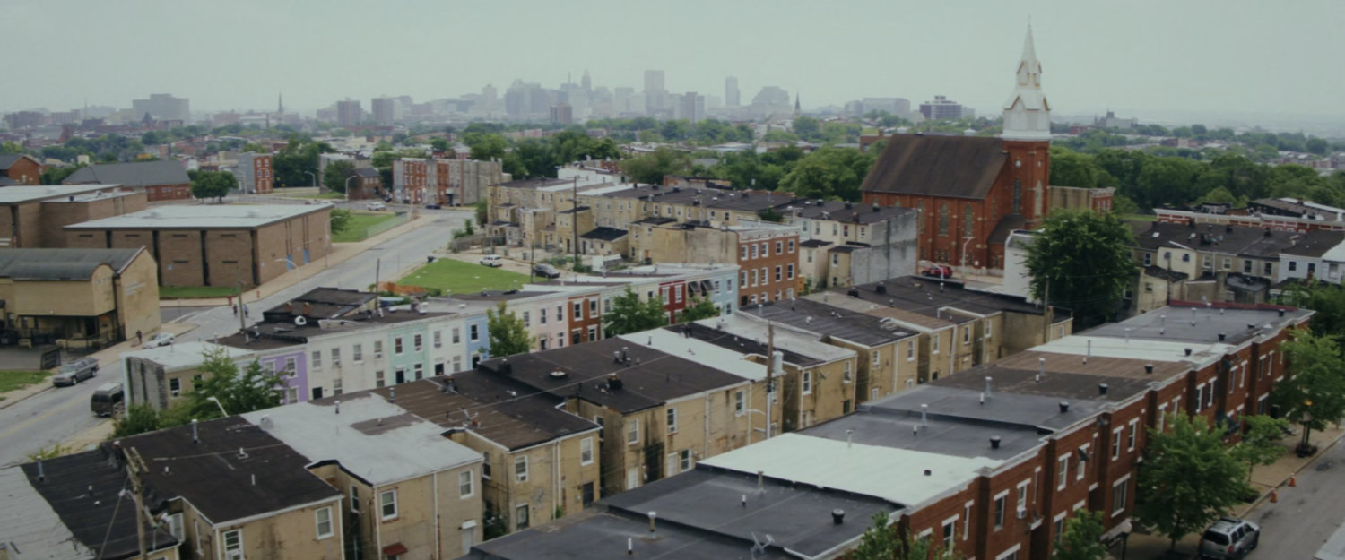 Aerial of Baltimore buildings and street.