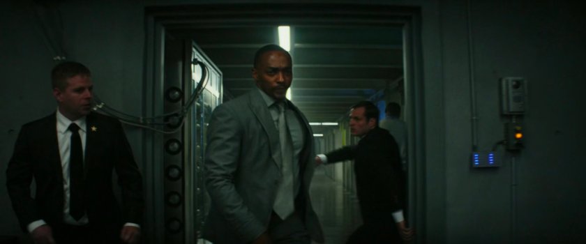 Sam pushes past Secret Service agents into the PEOC.