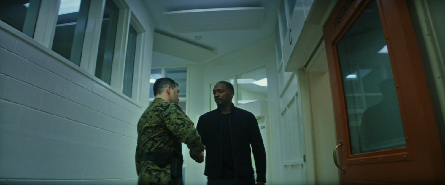 Sam and Sergeant Payumo inside of Joint Base Anacostia-Bolling prison.