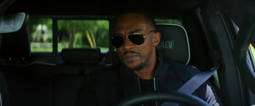 Sam driving on a road in Washington DC.