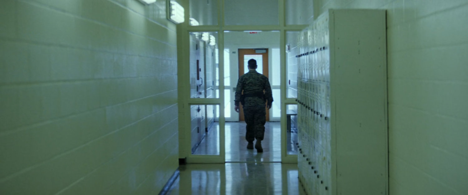 Payumo in hallway in Joint Base Anacostia-Bolling prison.