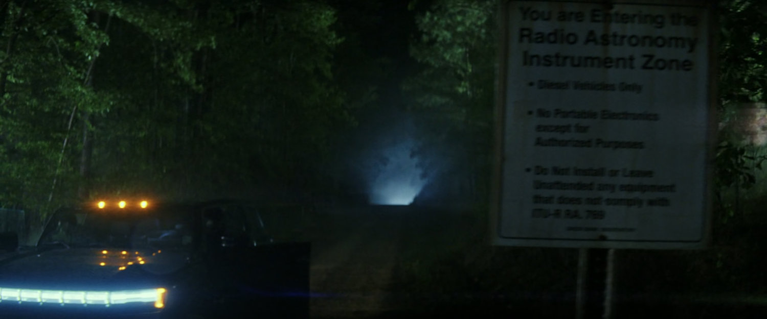 Road outside Camp Echo One at nighttime.