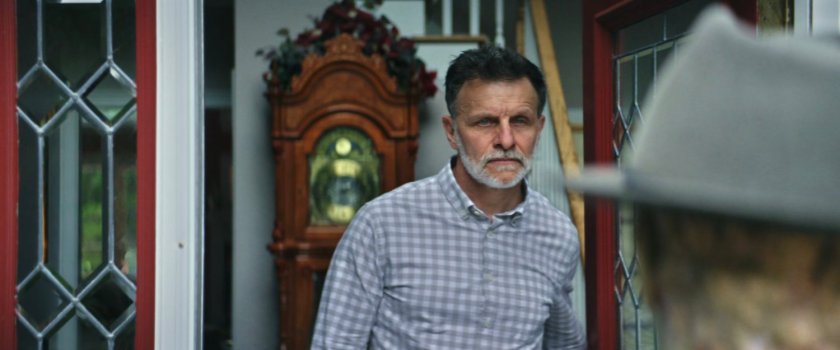 Admiral answering his front door.