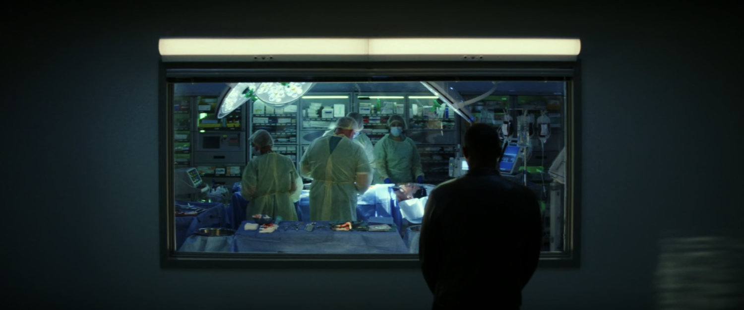 Sam watching surgery in Walter Reed operating room.