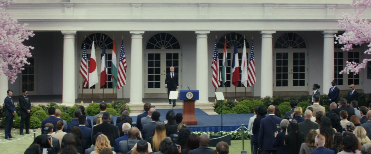 President Ross entering the Rose Garden at the White House.